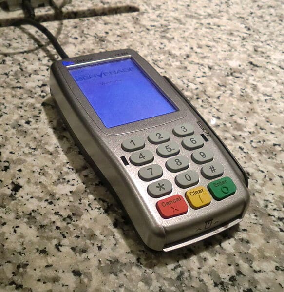 A credit card terminal. You may have to enter your PIN if you use one of these.